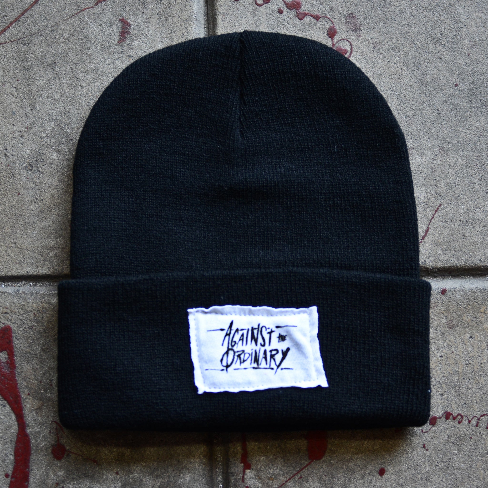 Against the Ordinary Black Beanie with White Stitched Label